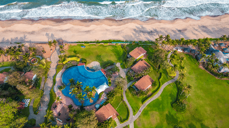 Promotional creative for Waves and Work Retreat at Mamallapuram showcasing a coastal workcation with scenic surroundings.