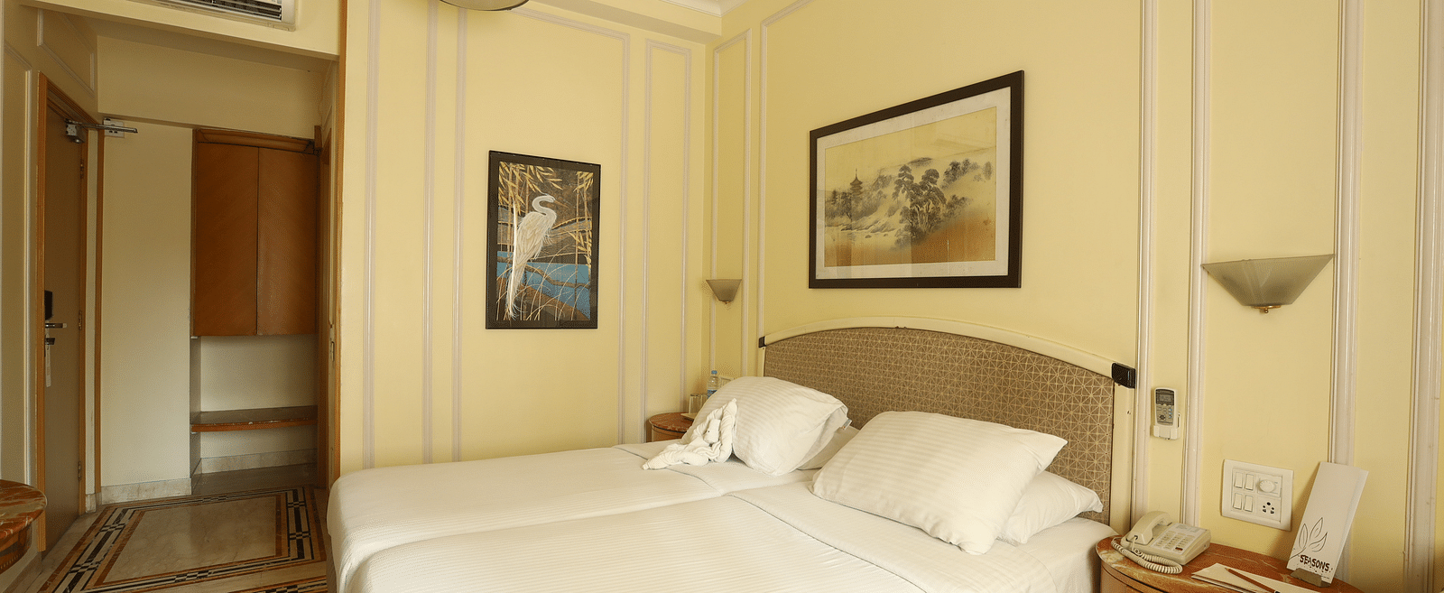 Twin beds in the Standard Room at Regency Hotel, Mumbai.