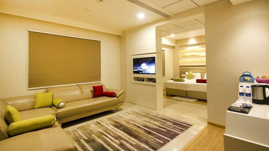 Sitting room of the Suite with sofa and television at Art Boutique Hotel, Hyderabad