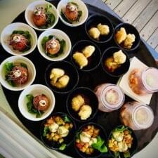 Tray of colourful appetisers in bowls, including seafood and fruit, served at Tamarind Hills Resort and Villas, Antigua.
