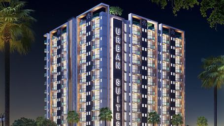 Facade view of Urban Suites by BluSalzz, Jaipur against the night sky, with the building glowing beautifully in the evening light.