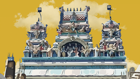 An ornate, colourful temple gopuram under a bright yellow, cloudy sky.