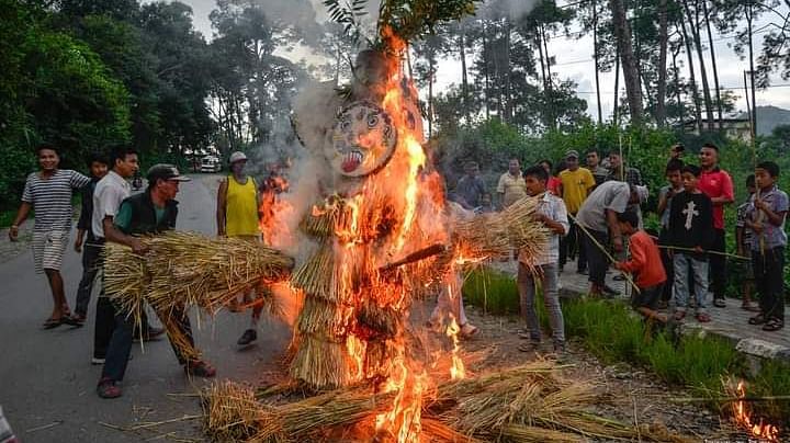 Three-legged effigy burning during the Gatha Muga Charhe festival