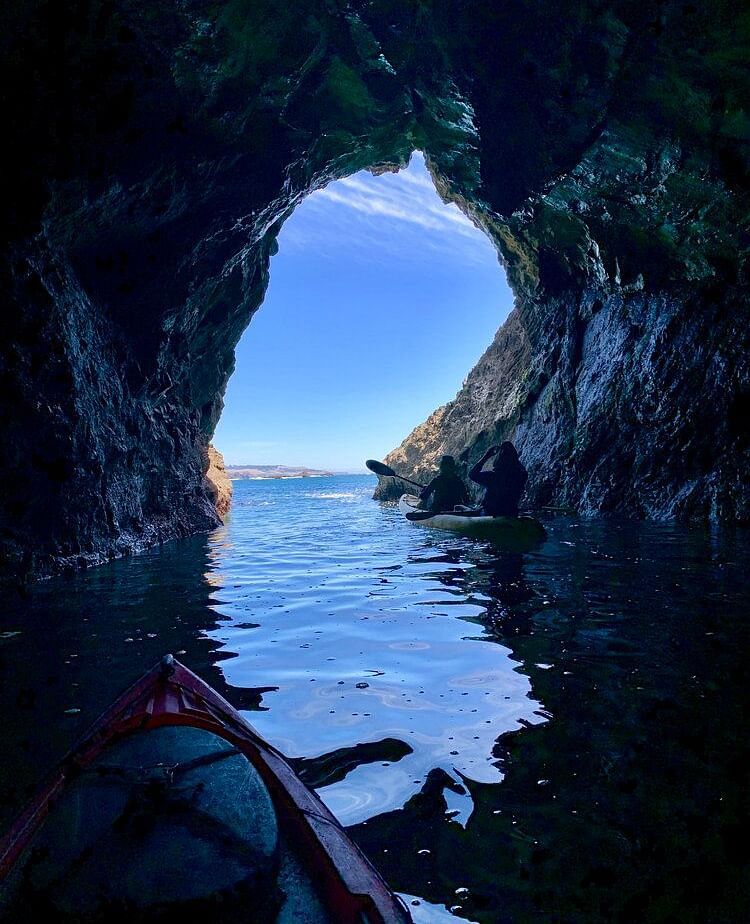 People Kayaking through a cave - Brewery Gulch Inn & Spa