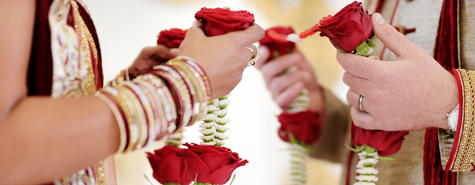 An image capturing a close-up of an Indian wedding ritual.