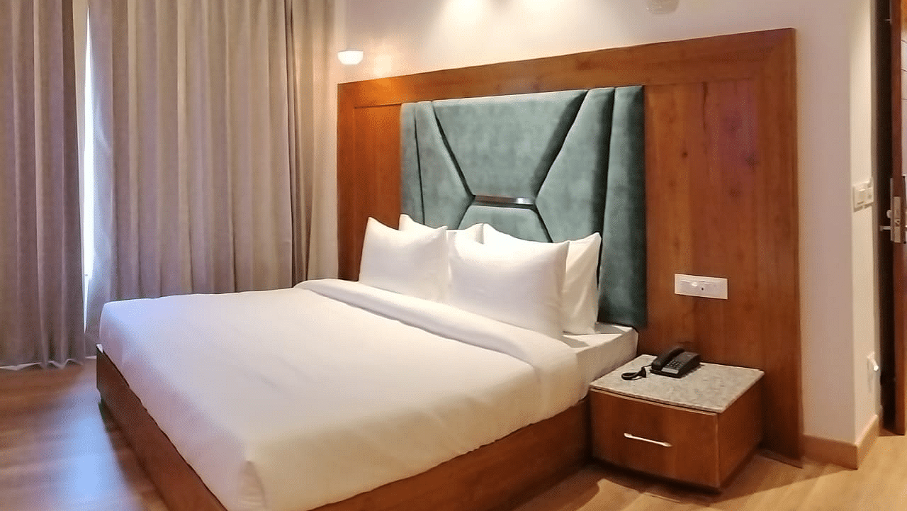 A large bed in Deluxe Non-view Room at DLS Ark Holiday Inn, Banikhet.