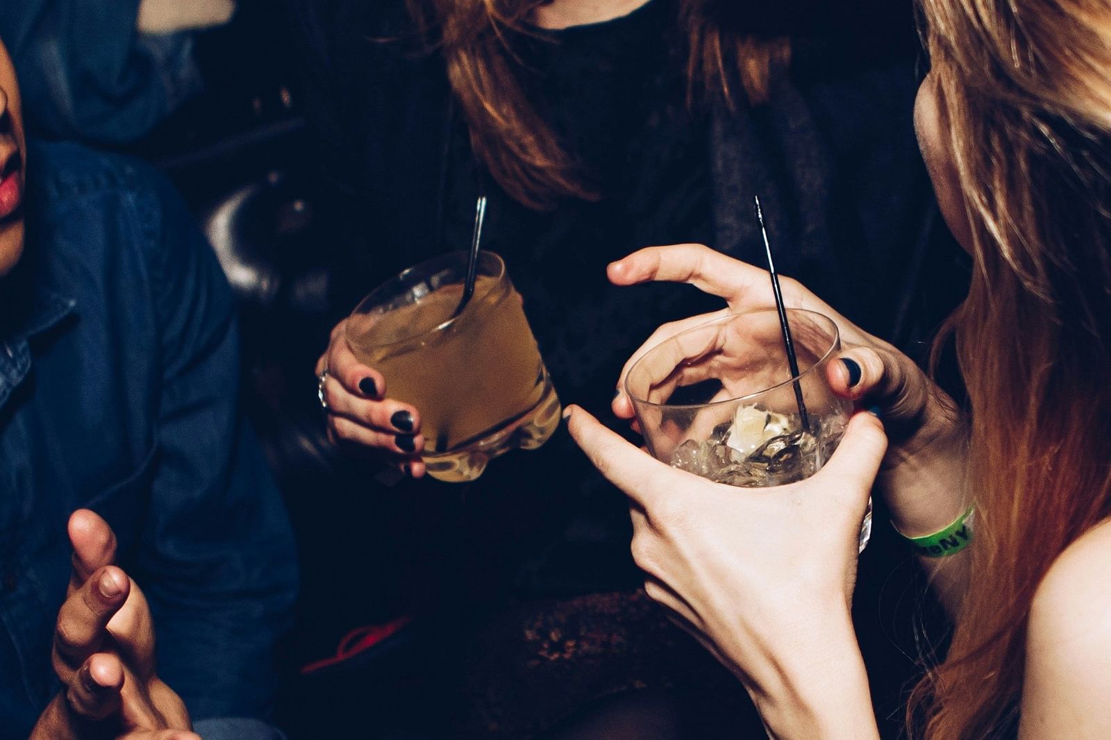 an image of a women holding drinks.