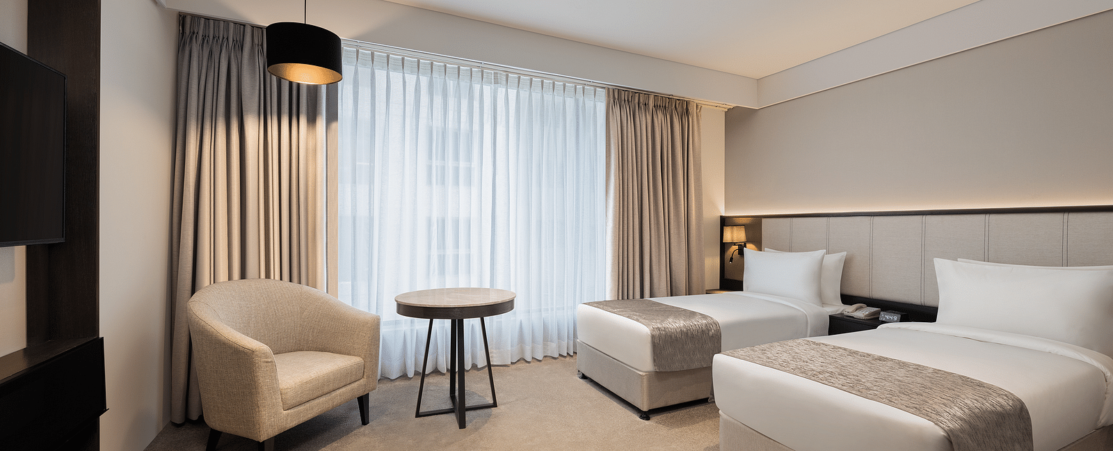 Deluxe Twin Room with twin beds at Essentia Premiere, Pune. 