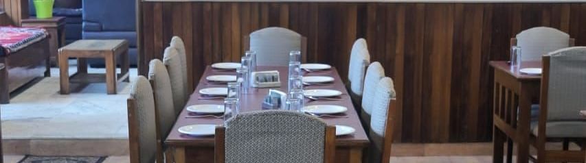 An image of the restaurant with its seating arrangement at Ecotel Chiminda, Pelling