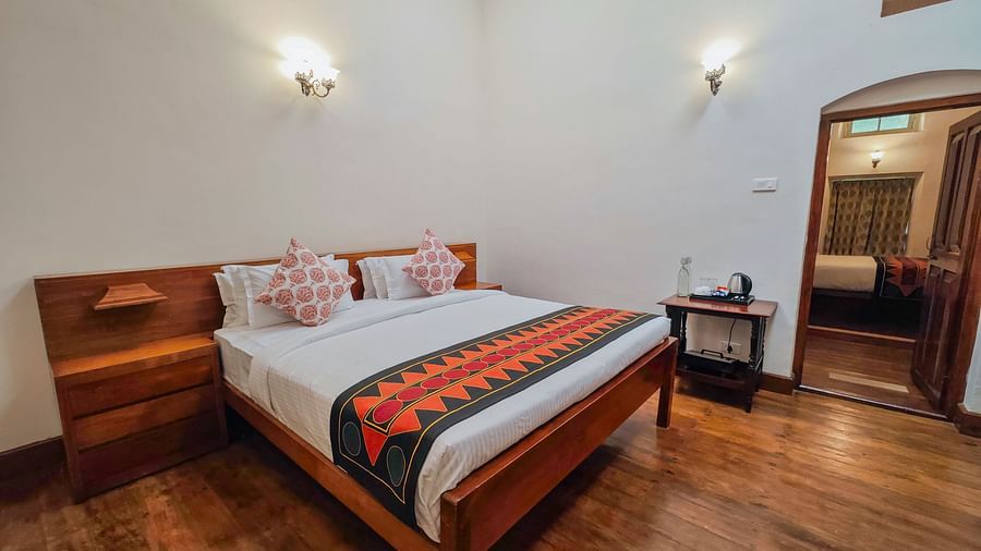 An overview of the Mayfair Suite Main Bedroom with a double bed - Ibex Stays & Trails, Coonoor (Leewood).