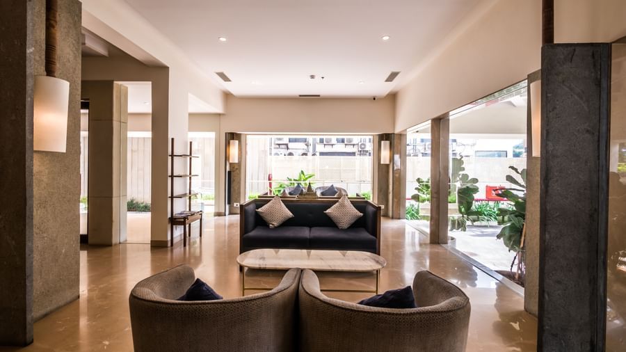 A spacious and inviting reception area featuring comfortable seating and elegant decor, welcoming visitors at Shilton Dee Cee.