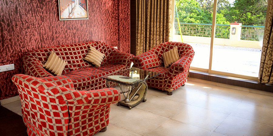 Royal Suite living area featuring sofas and a big widow.