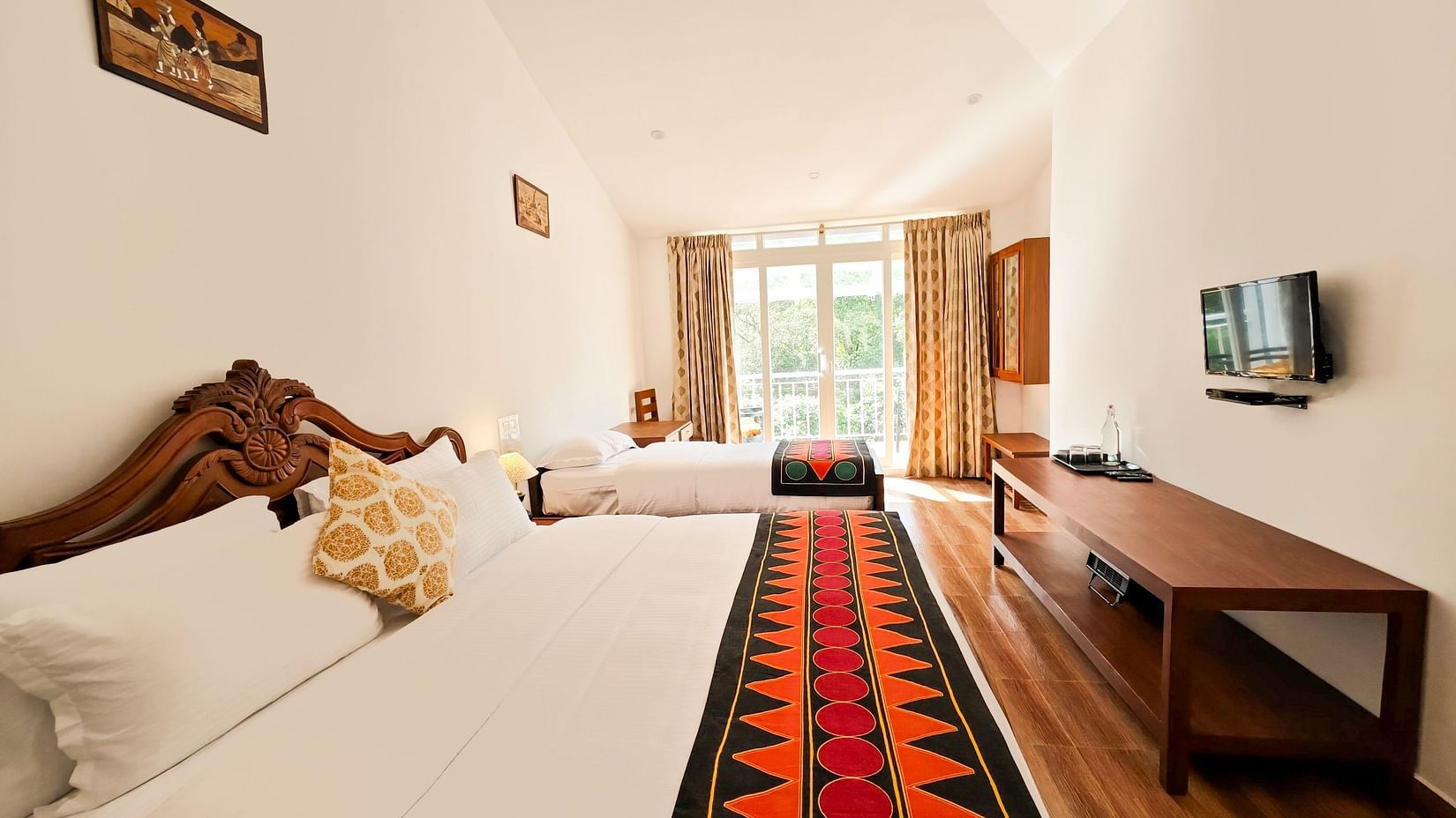 an image of a side view of a bedroom with a balcony at Ibex Stays & Trails, Valparai (Mistly)