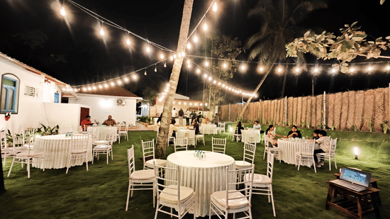 Evening wedding lawn at Ibex Resorts, Coimbatore (Kakarla), with elegant outdoor seating and festive lighting for memorable celebrations.