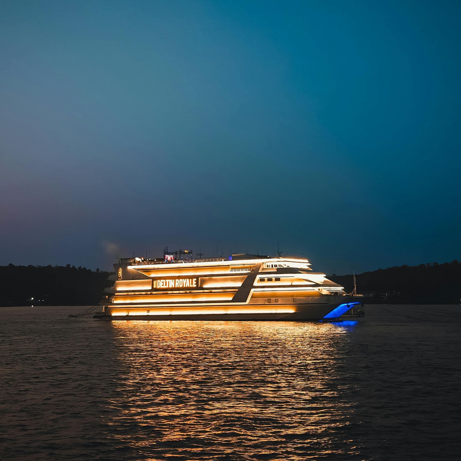 A cruise ship floating in the seat during dusk.