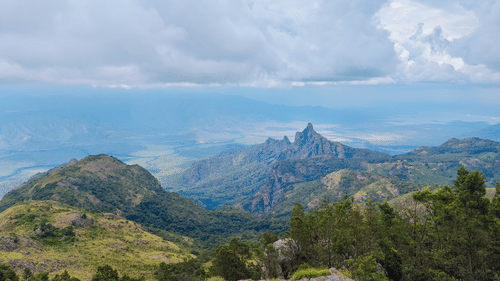 view from the top of a mountain of Kotagiri of the mountains and clouds 