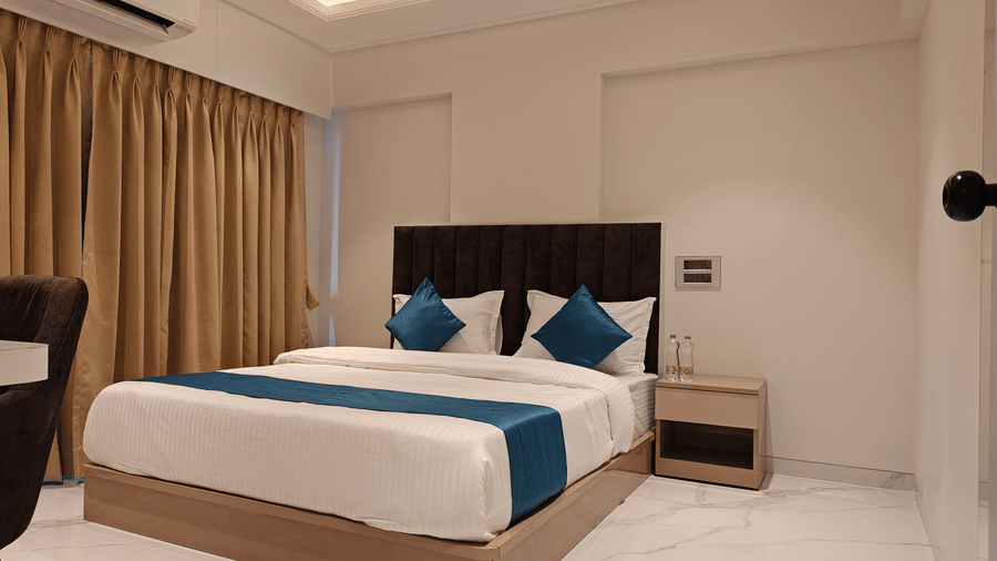 King bedroom with elegant interiors at Home2 Residency, Mumbai Airport