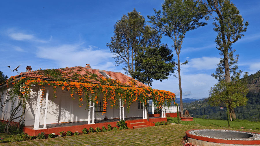 Facade image of a room in the daylight with a well in front of it - Ibex Resort, Coonoor (Leewood).