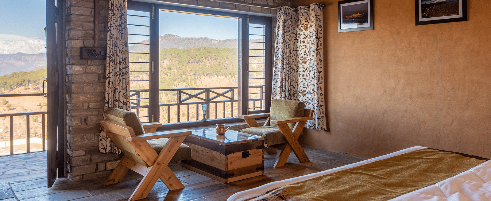 Cosy bedroom with rustic furniture and mountain view through large windows. - Blusalzz Homes The Himalayan Bungalow, Almora