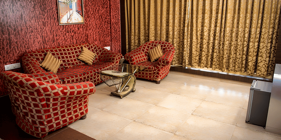Royal Suite living area featuring sofas and a big widow.
