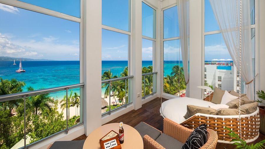 A seating area facing the beach in our Montego Bay suite - S Hotel Montego Bay, Jamaica