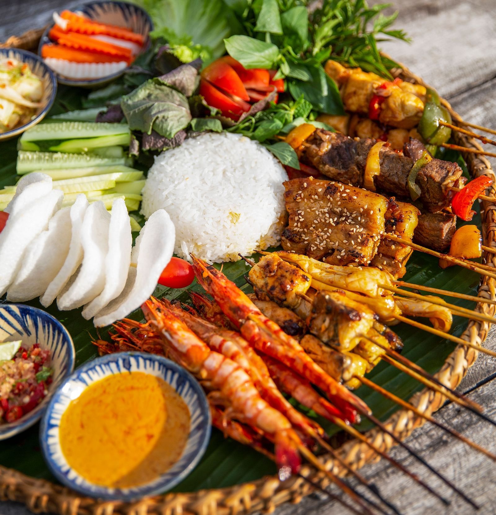An image of a platter with different kinds of food, involving meat and other vegetables - Alibu Resort Nha Thrang