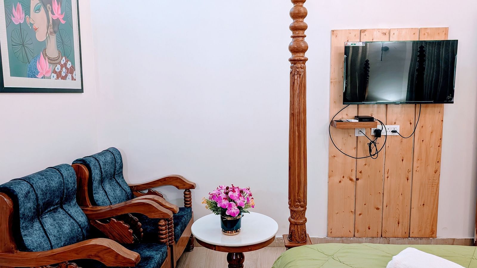 image featuring a cushioned couch along with a wall mounted television in the pool side cottage at dip holidays