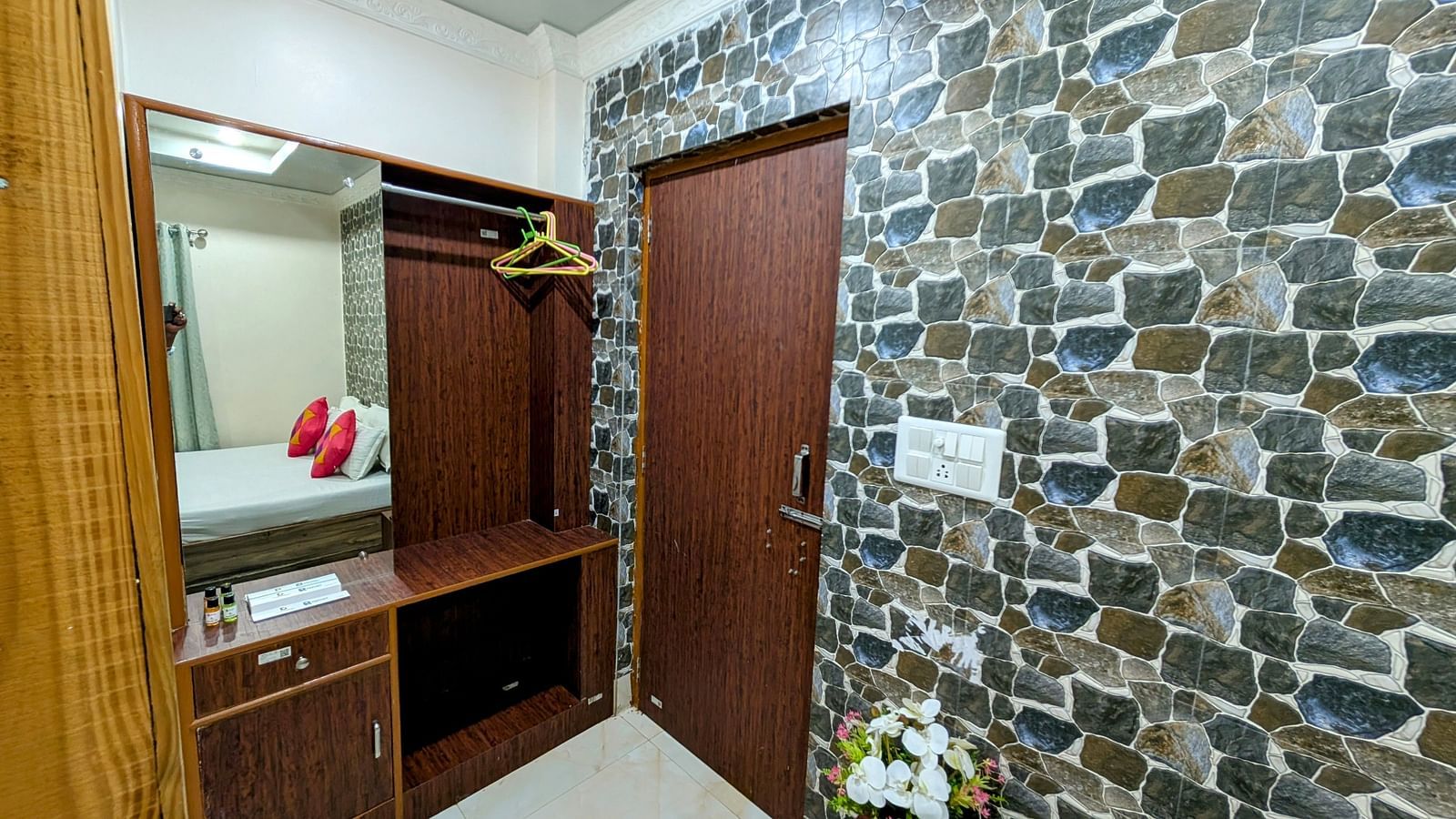 image featuring a door along with a closet and a dressing table beside it in a standard room at dip holidays