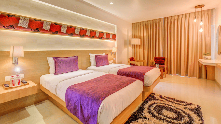 A view of the twin bed at Premium room at The SSK Solitaire Hotel & Banquets, Mumbai Naka - Nashik