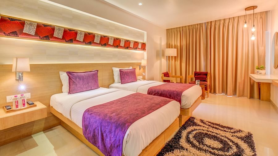 a view of the twin bed at Premium room at The SSK Solitaire Hotel & Banquets, Mumbai Naka - Nashik