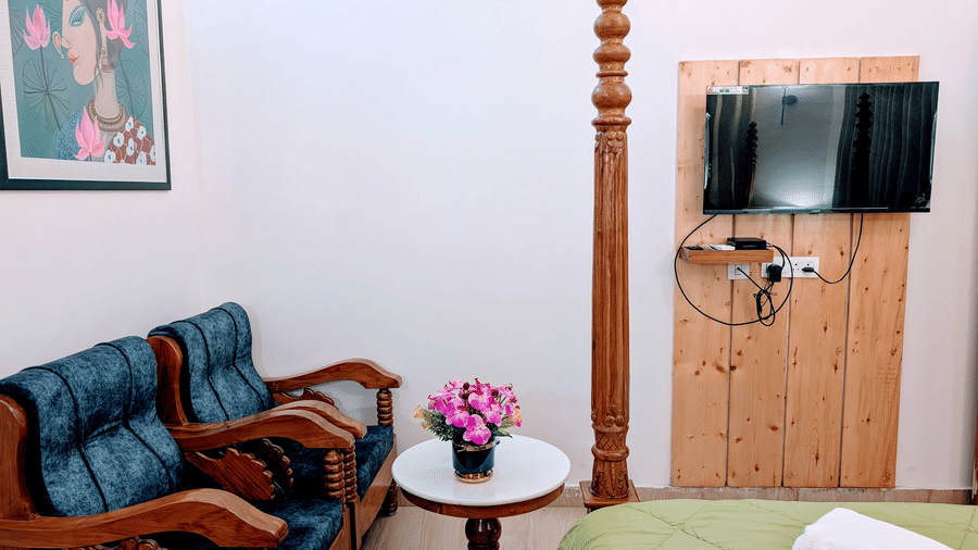 Premium hotel room featuring a cosy seating area and modern amenities.