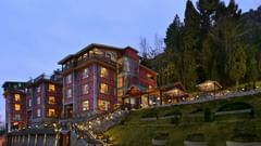 Facade at Golden Tulip,Srinagar featuring breathtaking view of the property in the evening amidst lush greenery