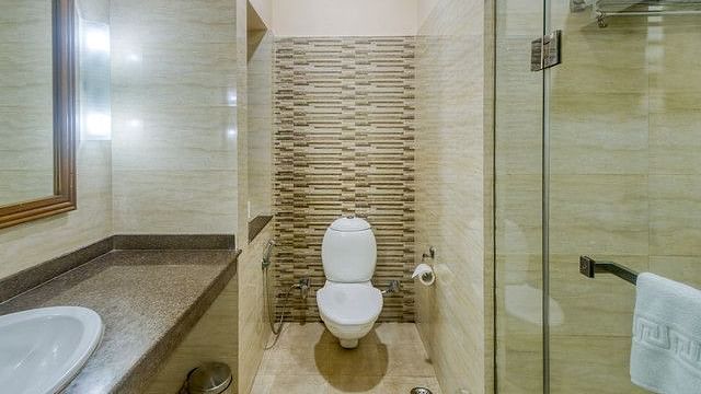 Clean resort bathroom with shower and modern fixtures for guests.