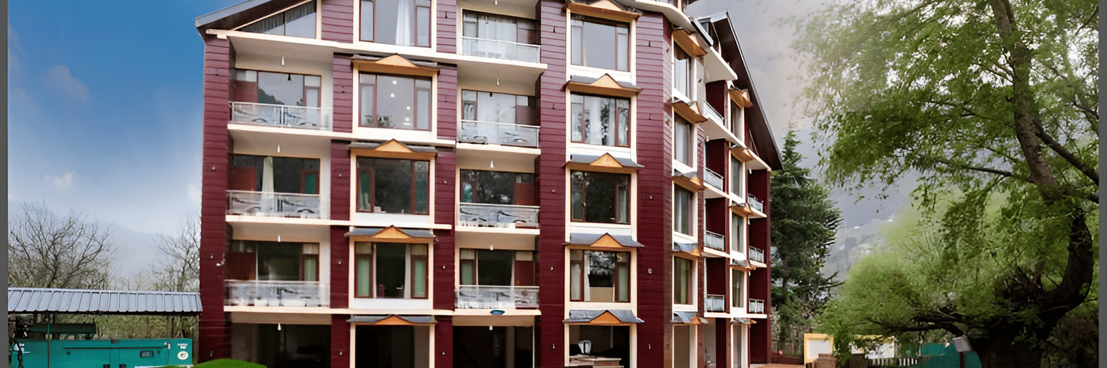 Image of the facade of the hotel with clear sky in the background | DLS La Serene Manali