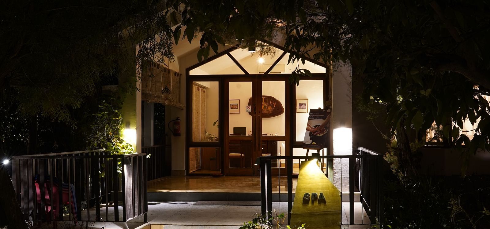Entrance to the spa at Saraca Resort & Spa Corbett at night