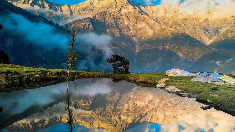 white clouds reflecting on blue water  @ Lamrin Norwood Green, Palampur