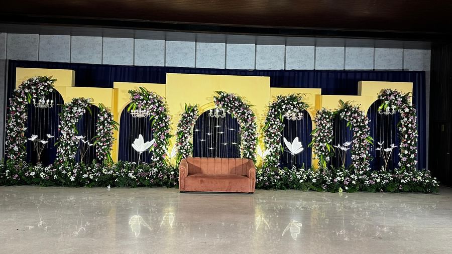 Event stage with vibrant yellow floral decor at VRR Astoria Hotel and Convention Centre