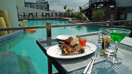A beautifully plated Indian started dish served at out  poolside rooftop restaurant overlooking the swimming pool - Senses Hotel