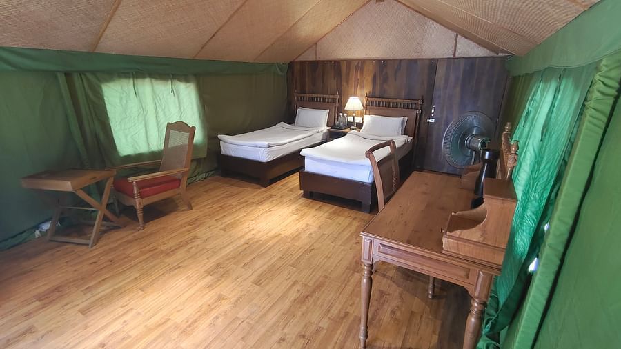view of a tent with two single beds and workdesks - The Jamoon, Corbett