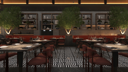 Restaurant dining room at Tulip Inn Bidar with dining tables, chairs, padded seating booths, potted plants, and a service bar in the background.
