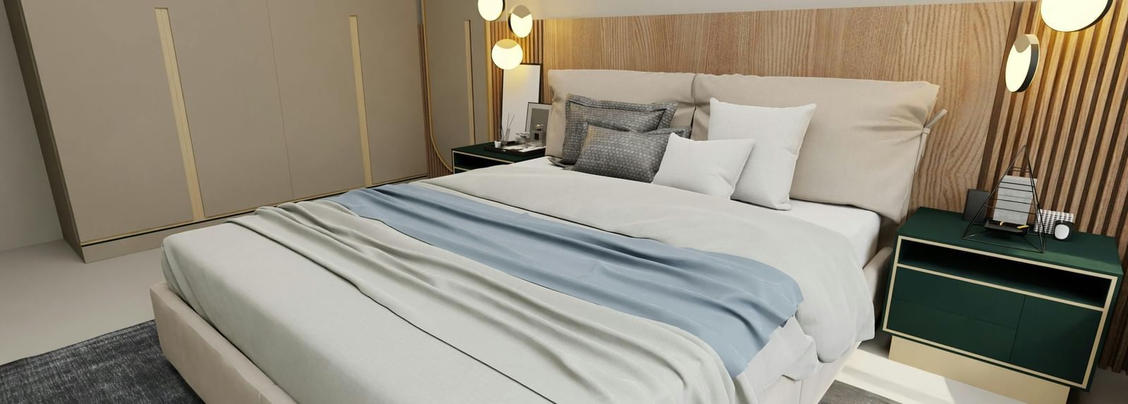 A modern bedroom with a bed featuring white and blue bedding, a nightstand with a lamp, and a headboard.