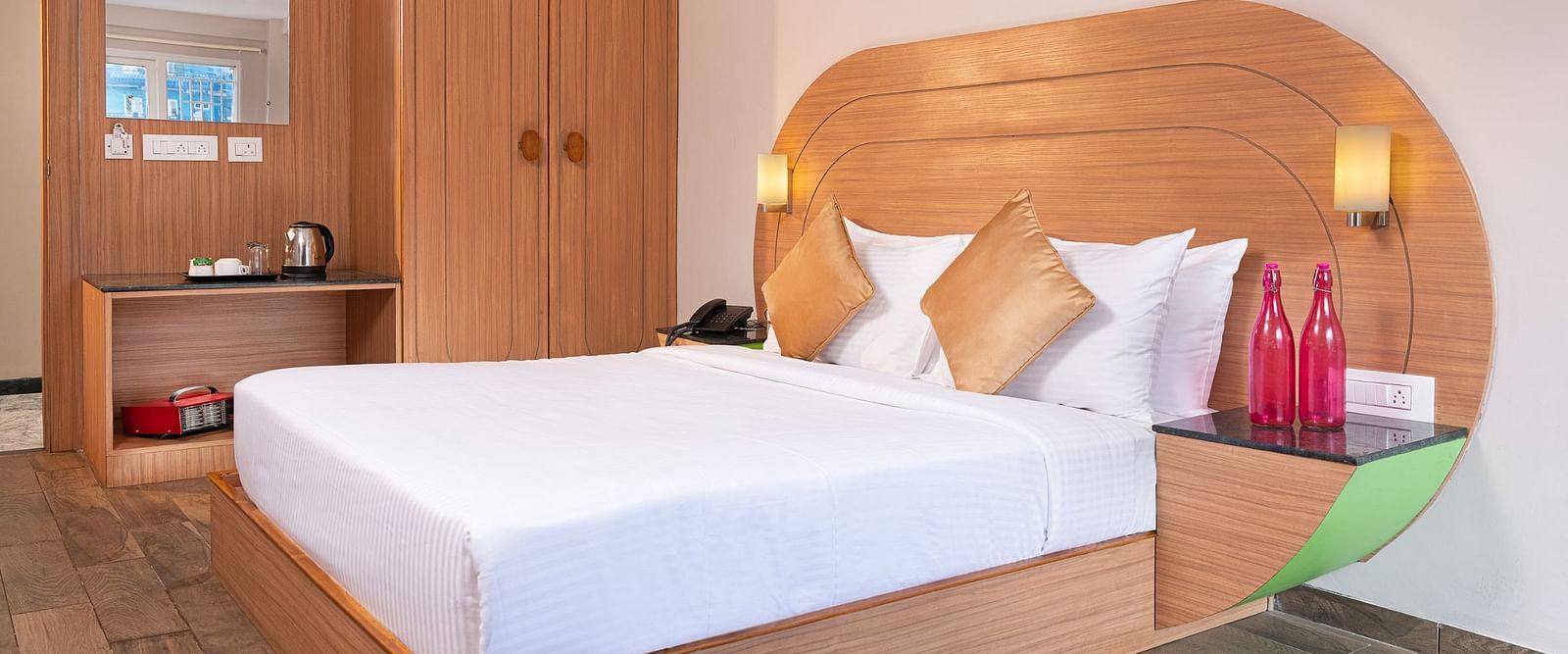 An image of a well furnished bedrooom  | Mango HIll Central, Ooty