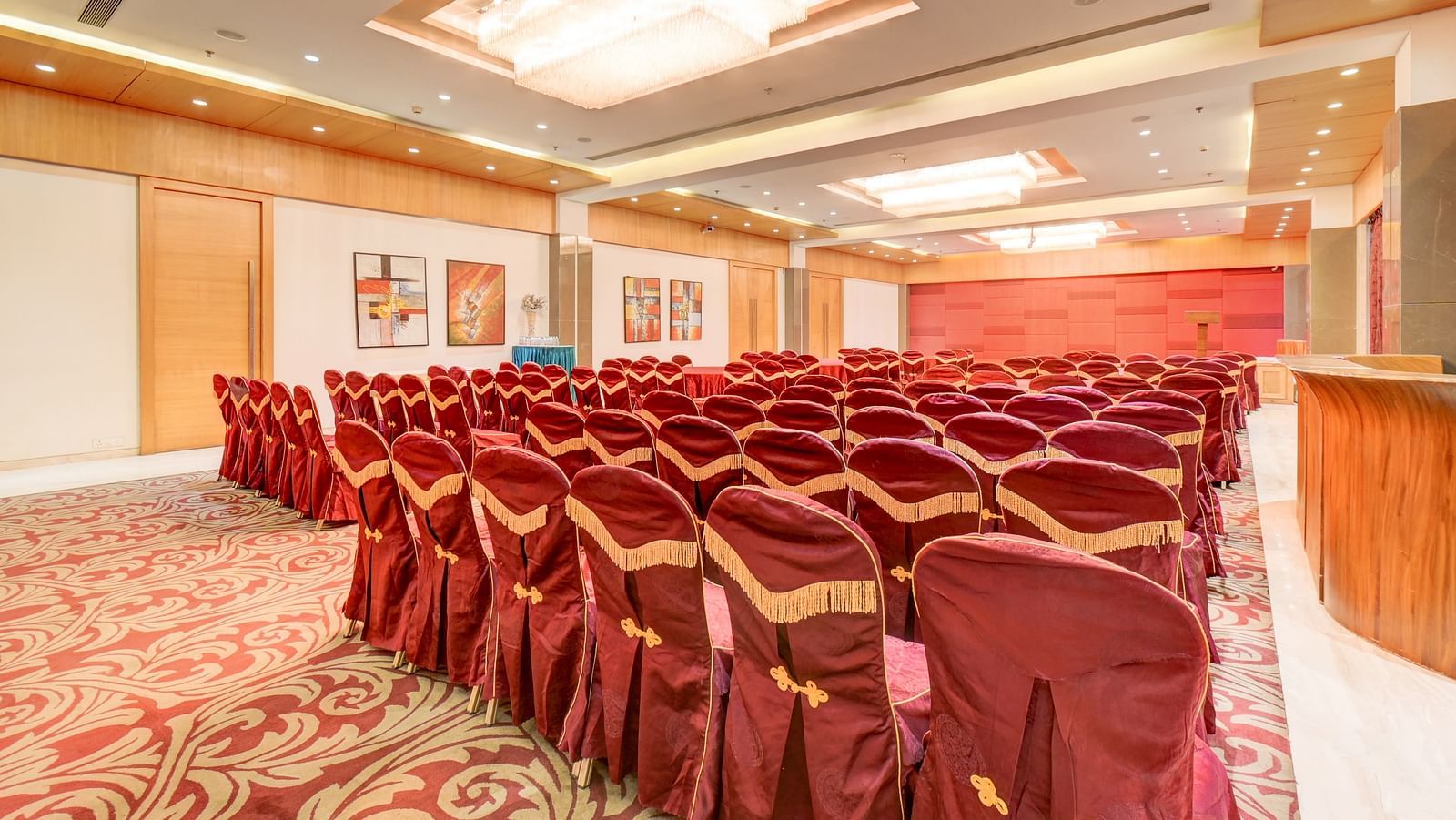 banquet hall with interior design and chairs at The SSK Solitaire Hotel & Banquets, Mumbai Naka - Nashik