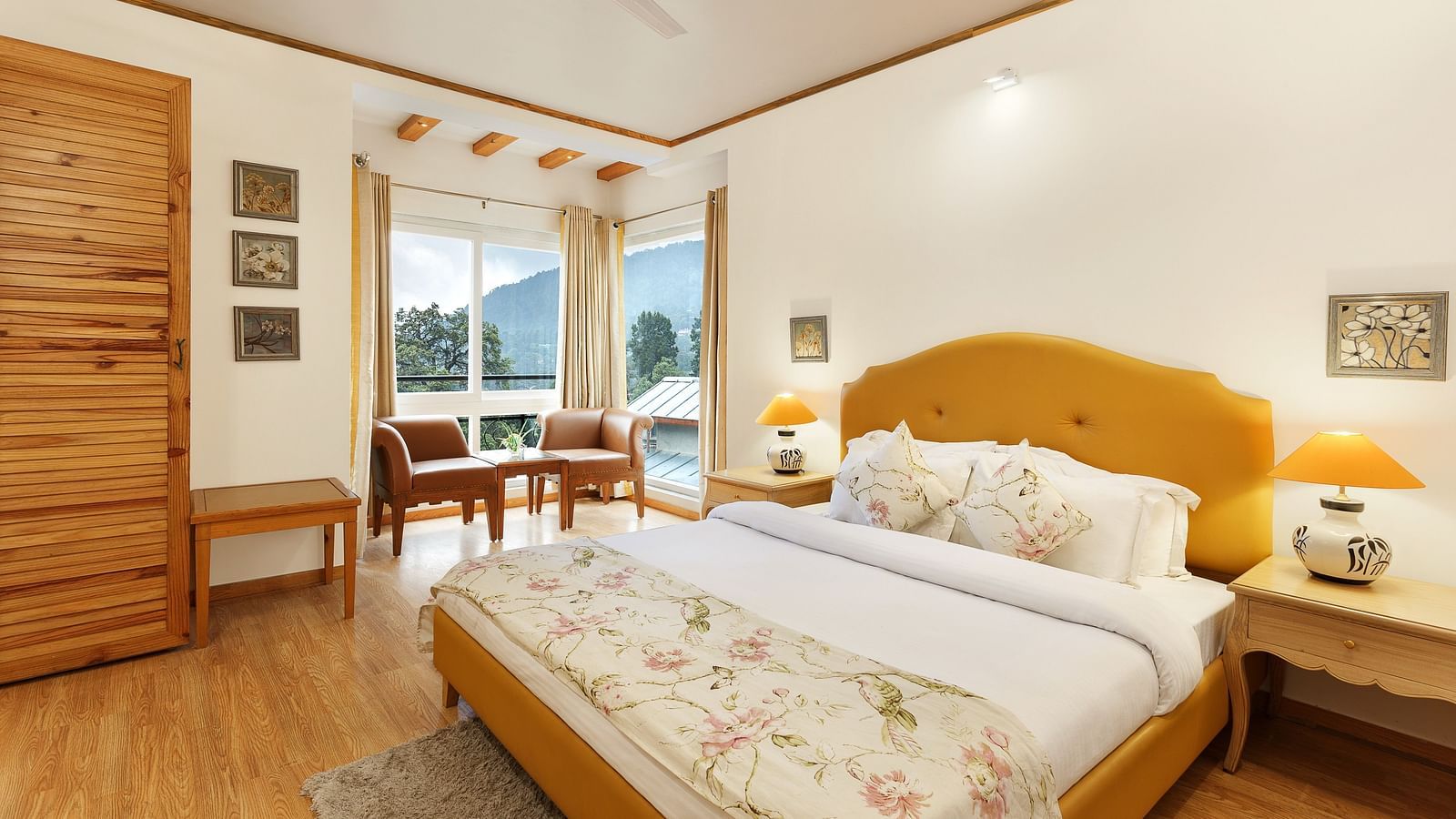 A cosy room with plushy bed, table lamp with makes the ambience homely - Pinewood Nainital 