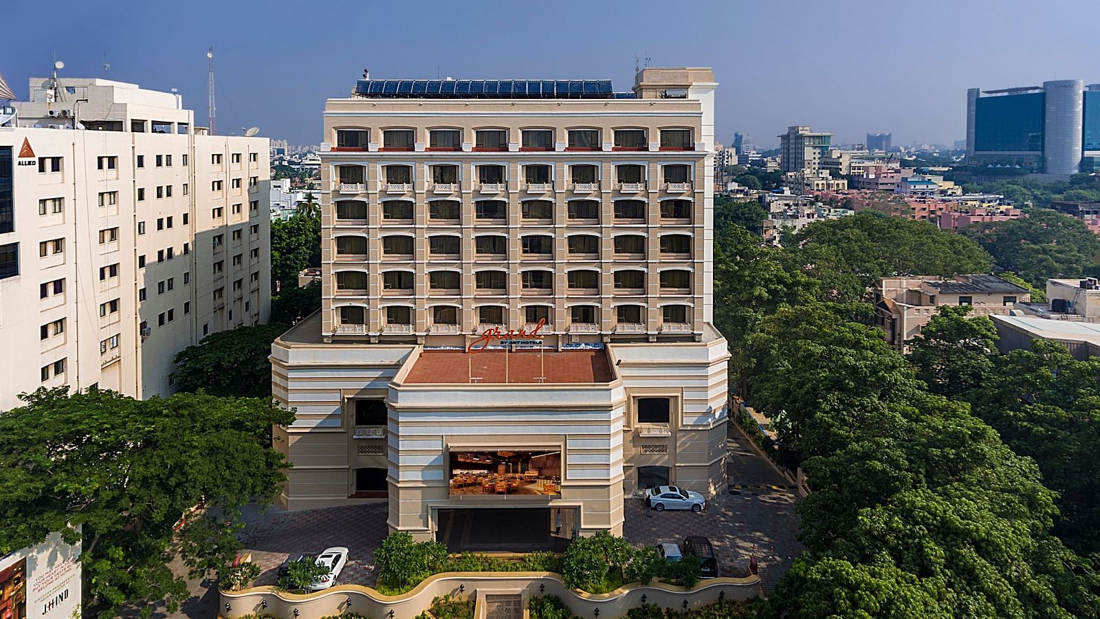 Facade view of Grand Chennai By GRT Hotels during day time.