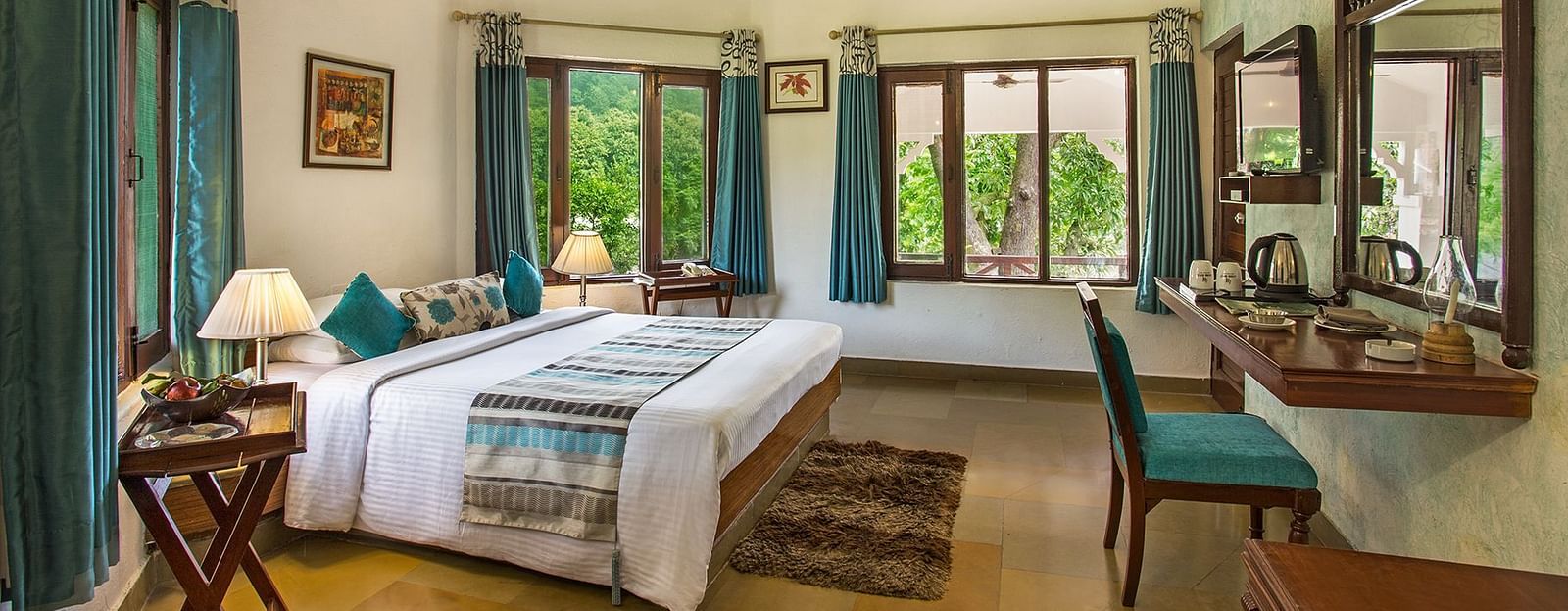 An image of a bedroom with king size bed, wooden ceiling where a fan is hanged,  cabinet and tables, etc. - The Riverview Retreat, Corbett