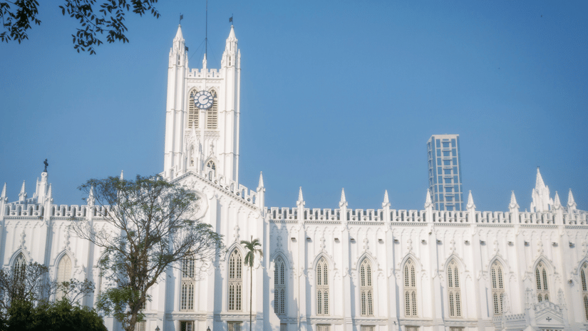 Gothic Revival church with a tall central tower, pointed arches, and landscaped surroundings at St. Paul’s Cathedral, Kolkata.
