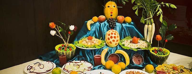 A table featuring a variety of delectable colourful salads and fruits at The Manor, Bareilly
