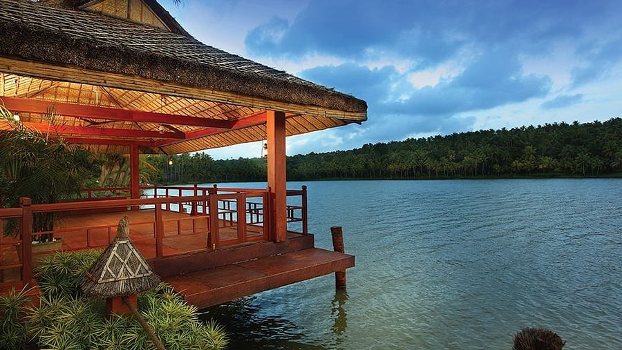 A balcony setup overlooking the lake with a scenic natural view