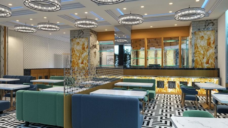 Side view of a restaurant interior featuring cushioned chairs at Hotel Mumbai House, Vashi.
